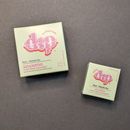 Dip Rose + Matcha Tea Shampoo in a light green box in regular 4oz and .75oz travel sizes. Sold at Coyote Supply Co a BIPOC and LGBTQIA+ owned zero waste witch store in Reno Nevada