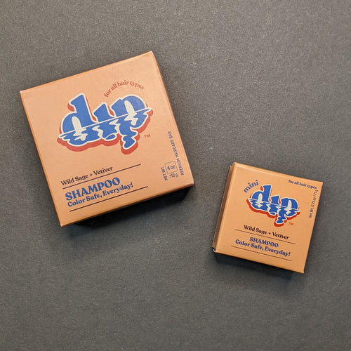Dip Wild Sage + Vetiver Shampoo in an orange box in regular 4oz and .75oz travel sizes. Sold at Coyote Supply Co a BIPOC and LGBTQIA+ owned zero waste witch store in Reno Nevada