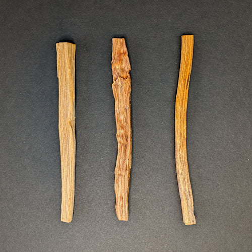 Three Tjarved sticks on a black background. 
Sold at Coyote Supply Co a BIPOC and LGBTQIA+ owned zero waste witch store in Reno Nevada