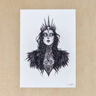 Black drawing on white paper of the Celtic Goddess The Morrigan, from the chest up.  Her hair is long & wavy & topped with a spiked crown adorned with a raven skull, she's wearing a high neck Irish lace blouse that looks Victorian & a raven feather cloak, & on the front of her chest is a triskelion. Available at Coyote Supply Co, a zero waste witch store in Midtown Reno, Nevada that is BIPOC owned