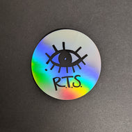 A circuar sticker with a holographic silver finish with a black eye and R.T.S. Sold at Coyote Supply Co a BIPOC and LGBTQIA+ owned zero waste witch store in Reno Nevada