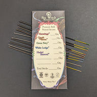 A black paper envelope  that reads Sea Witch Botanicals, with illustrations of strips of color and a rainbow art nouveau frame. In the frame is a cream background and text that reads 
Premium Bulk Natural Incense
Hermitage __ Qty
Quoth the Raven __ Qty
Green Fairy __ Qty
White Lodge __ Qty
Herbal Renewal __ Qty
Total Sticks __ Qty
Nature Misses You