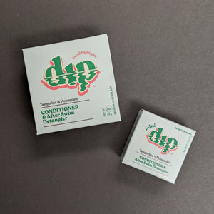 Dip Tangerine + Honeydew Conditioner in a baby blue box in regular 4oz and .75oz travel sizes. Sold at Coyote Supply Co a BIPOC and LGBTQIA+ owned zero waste witch store in Reno Nevada