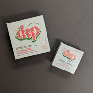 Dip Tangerine + Honeydew Shampoo in a baby blue box in regular 4oz and .75oz travel sizes. Sold at Coyote Supply Co a BIPOC and LGBTQIA+ owned zero waste witch store in Reno Nevada